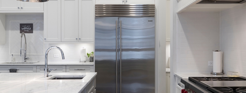 stainless-steel-refrigerator-beside-white-kitchen-cabinet-2343467